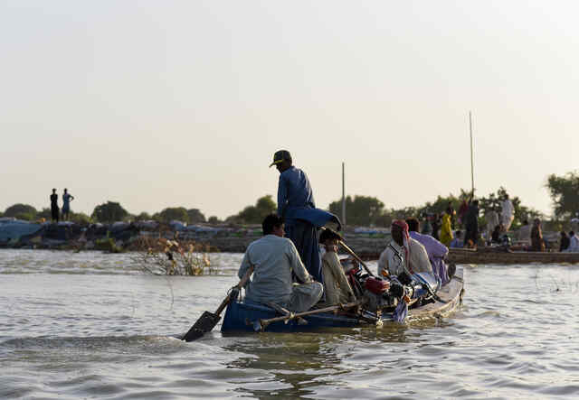 Farmers and locals who can afford to hire boats and commute in between villages during the worst flooding in Pakistan's history.